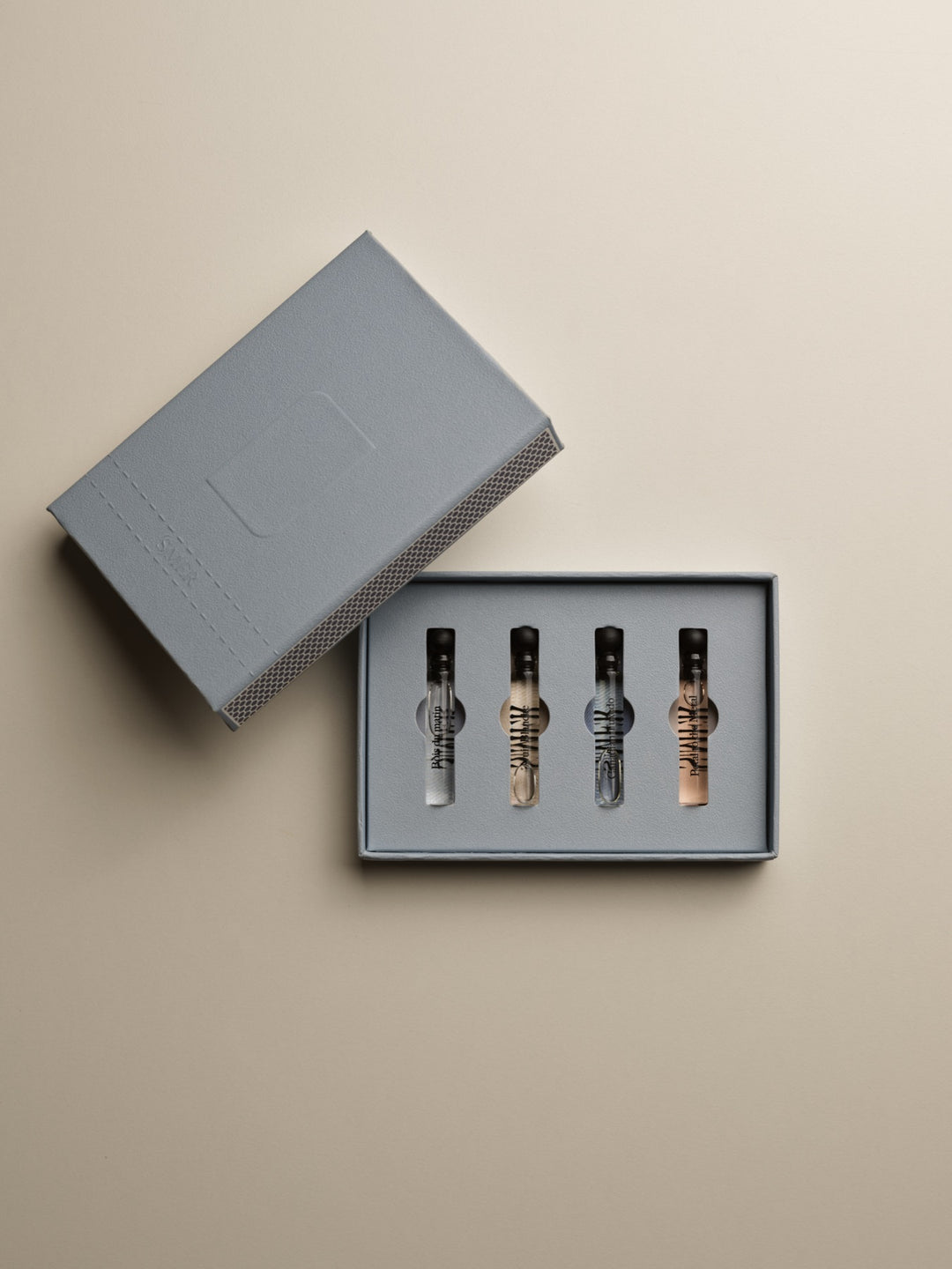 The (S)MER Match Box, open, with four vials